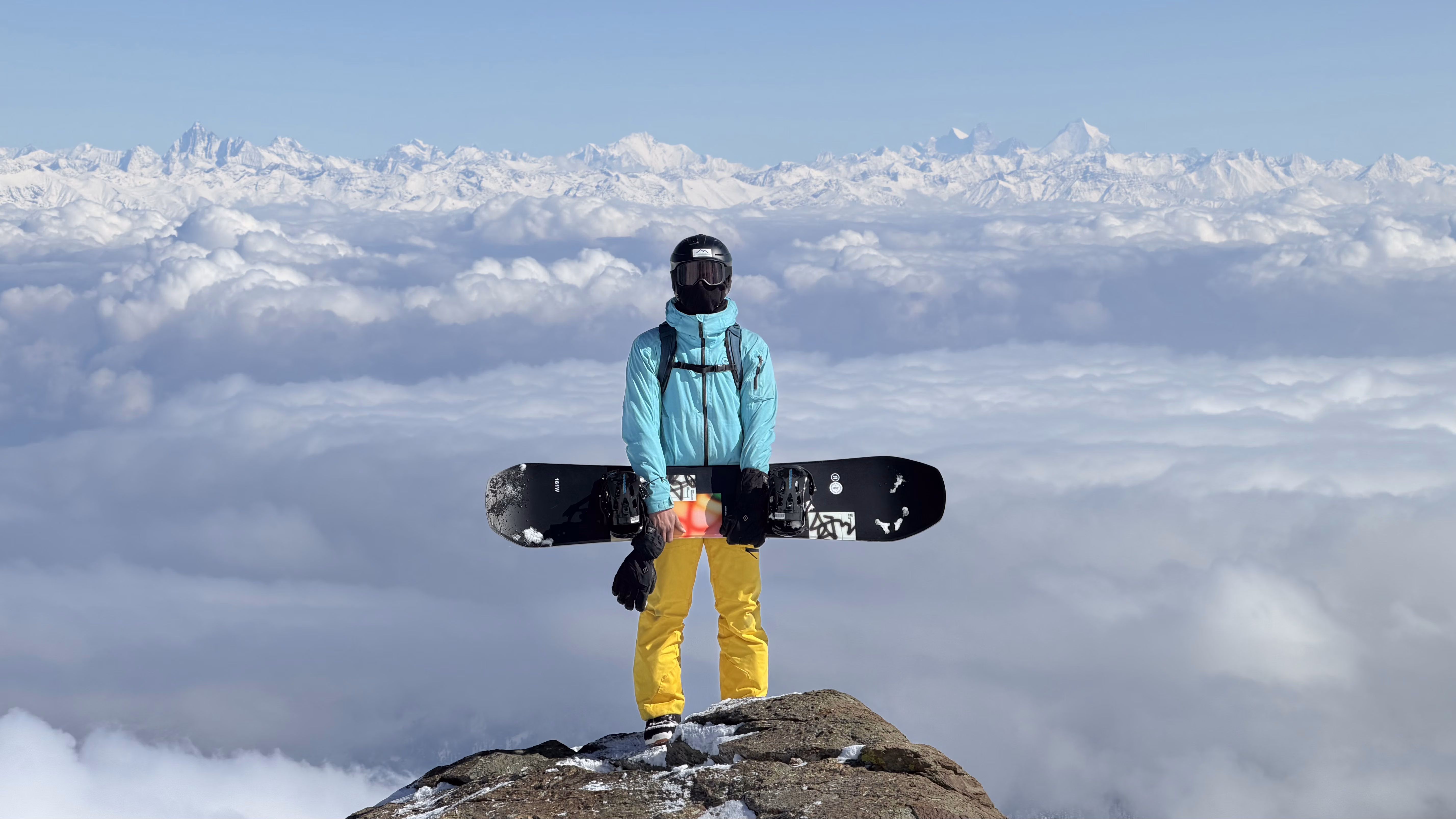 Splitboarders crossing high alpine terrain on an extended backcountry trip