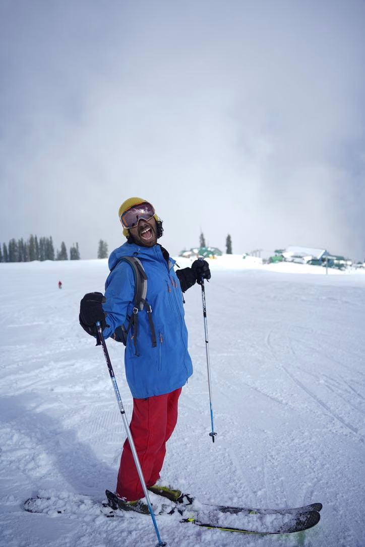 Learner skier working on edge control on a wide open slope