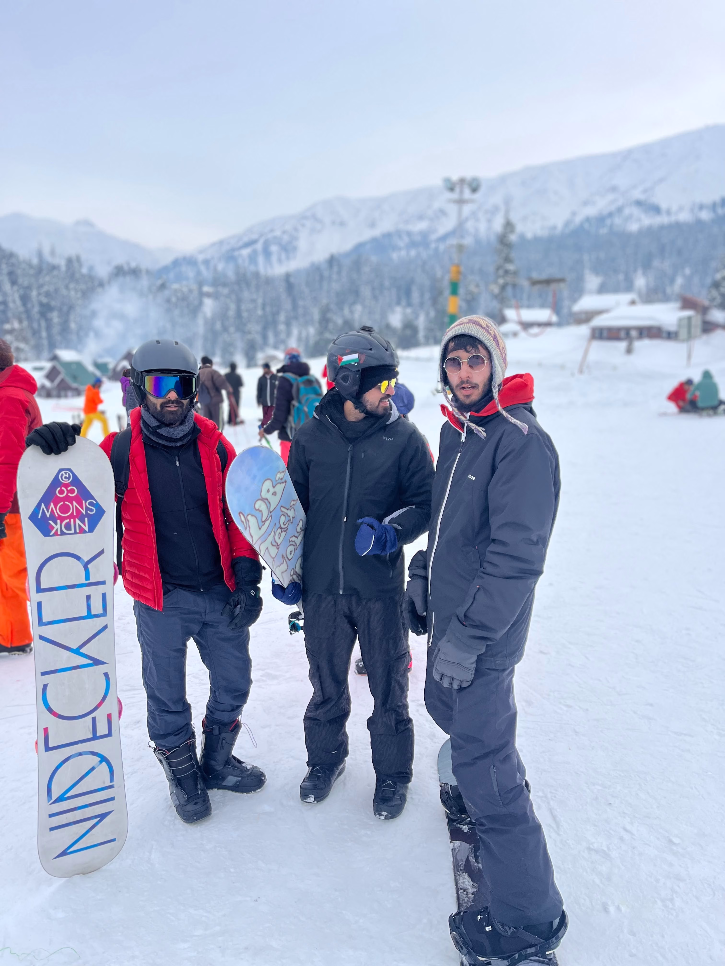 Beginner snowboarder learning to sideslip on the Gulmarg nursery slope