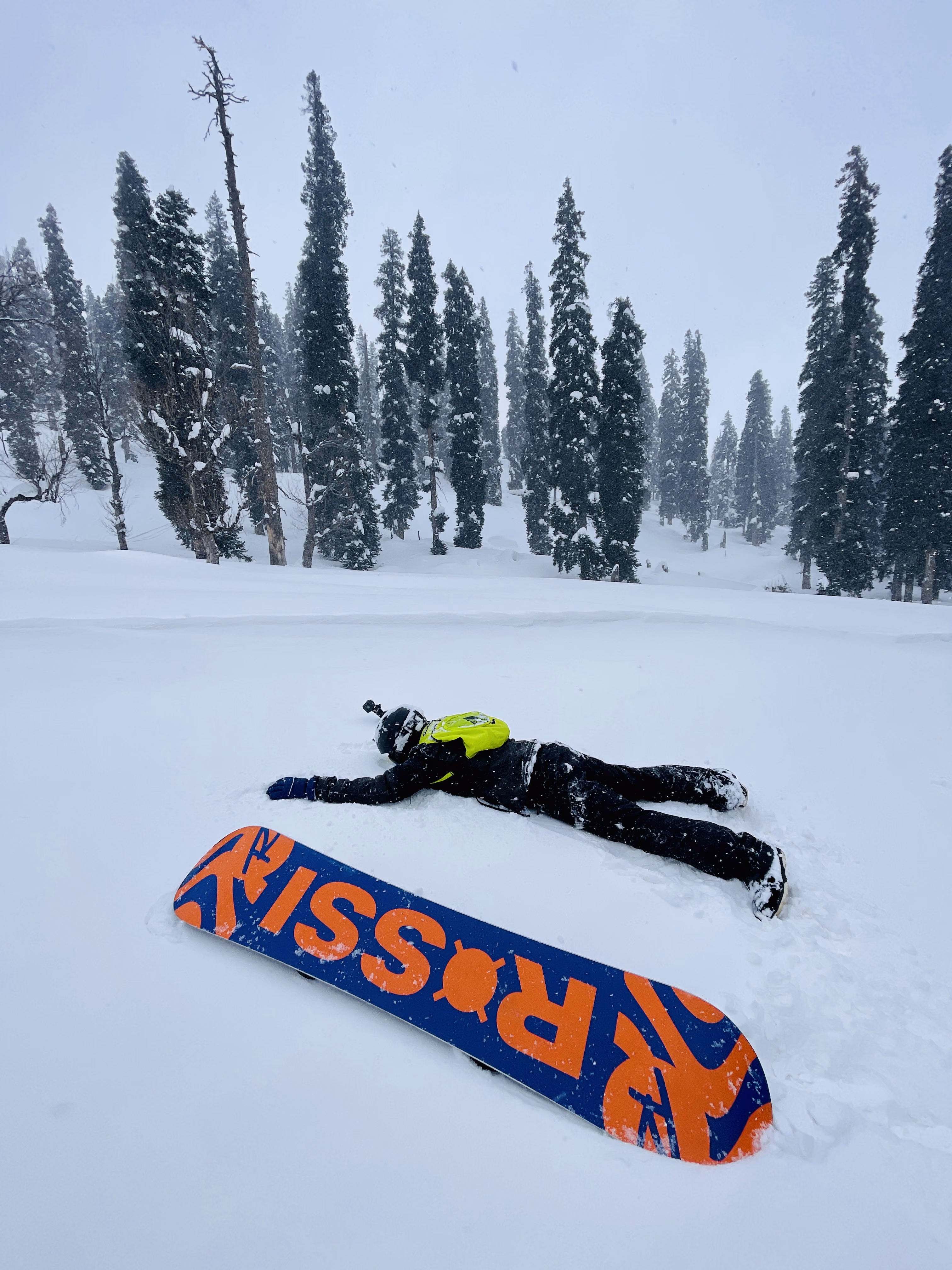 Snowboarder practising heel and toe edge turns on a gentle slope
