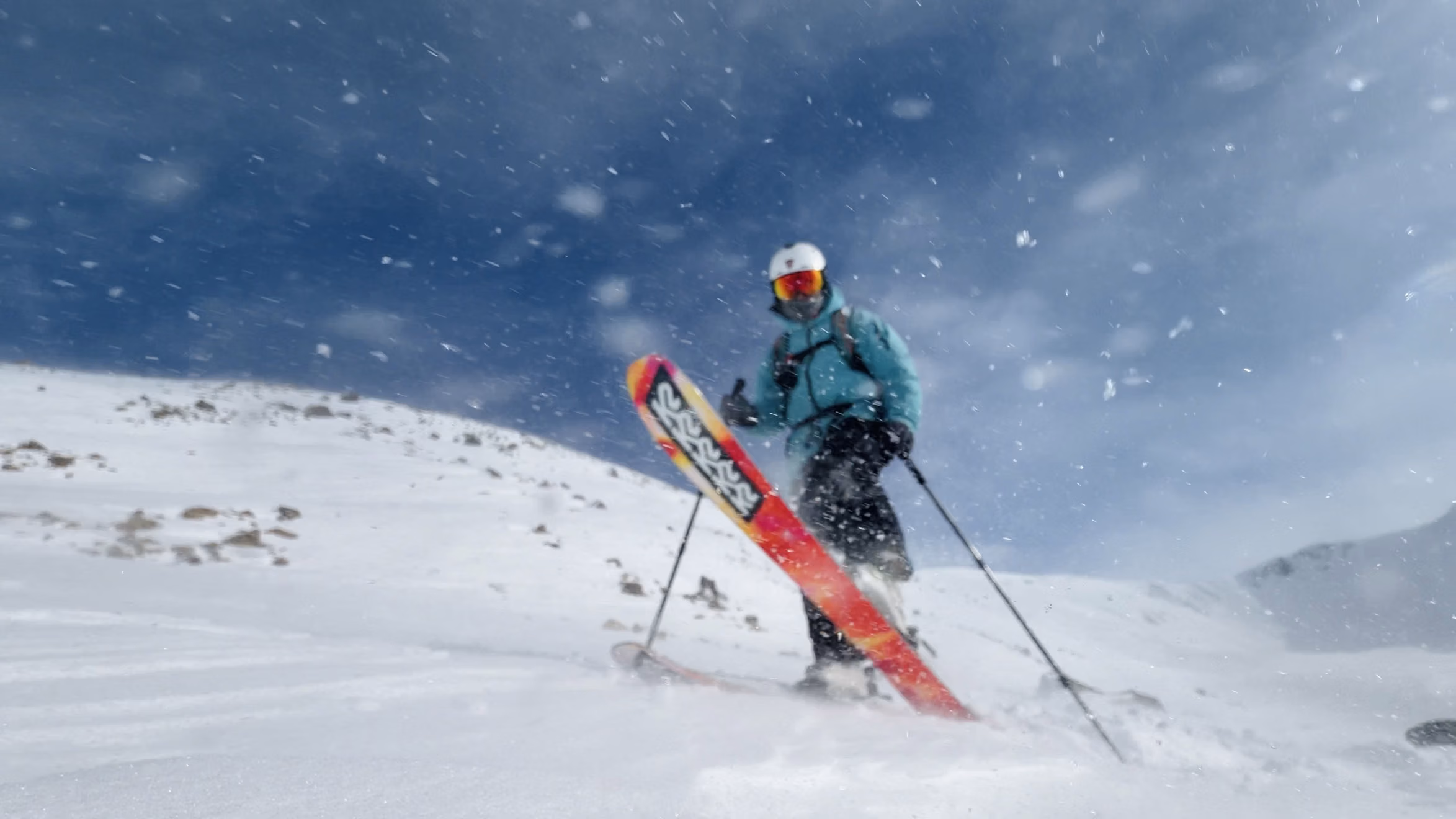 Freeride skier dropping into untracked powder off the Gulmarg gondola
