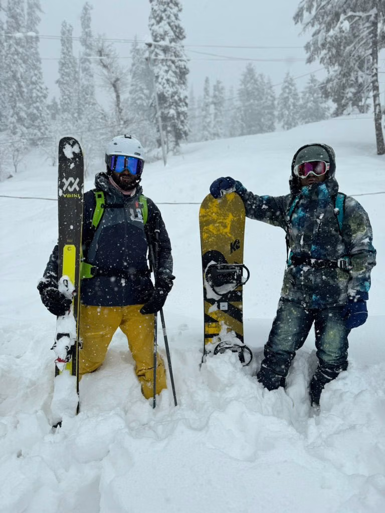 Instructor coaching a beginner through a turn on the nursery slope