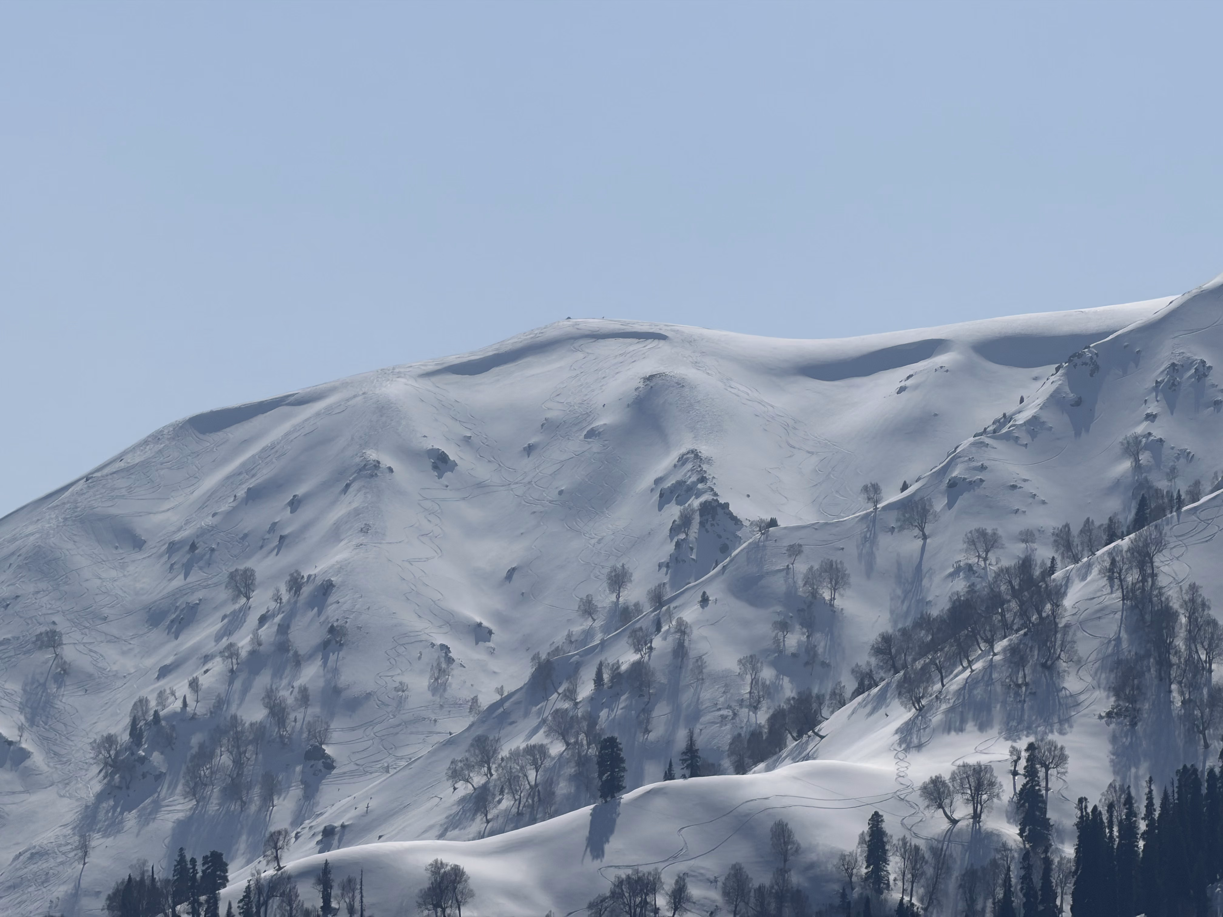 Skis, poles and snowboards lined up outside the Gulmarg rental shop